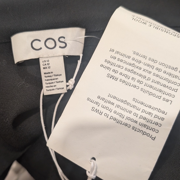 COS | Power-shoulder Open-back Waisted Wool Top In Black - Picture 11 of 15